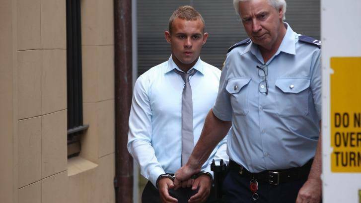Kieran Loveridge is escorted from the NSW Supreme Court in November 2013, having initially been sentenced to five years and two months for manslaughter. Photo: Kate Geraghty