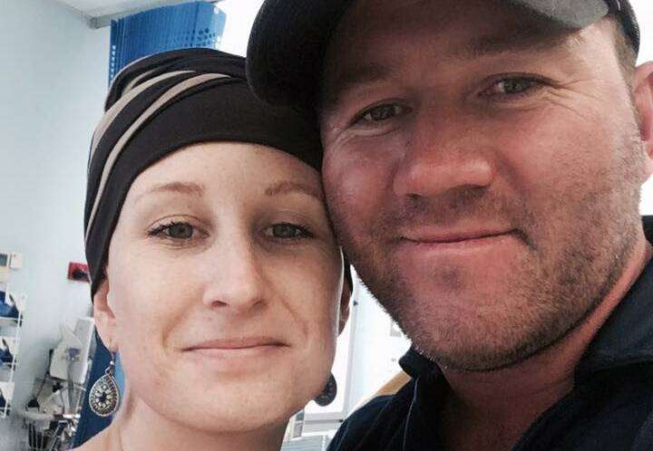 TEAMWORK: Jess and Dale Higgins at Jess's final round of chemotherapy in Port Macquarie.