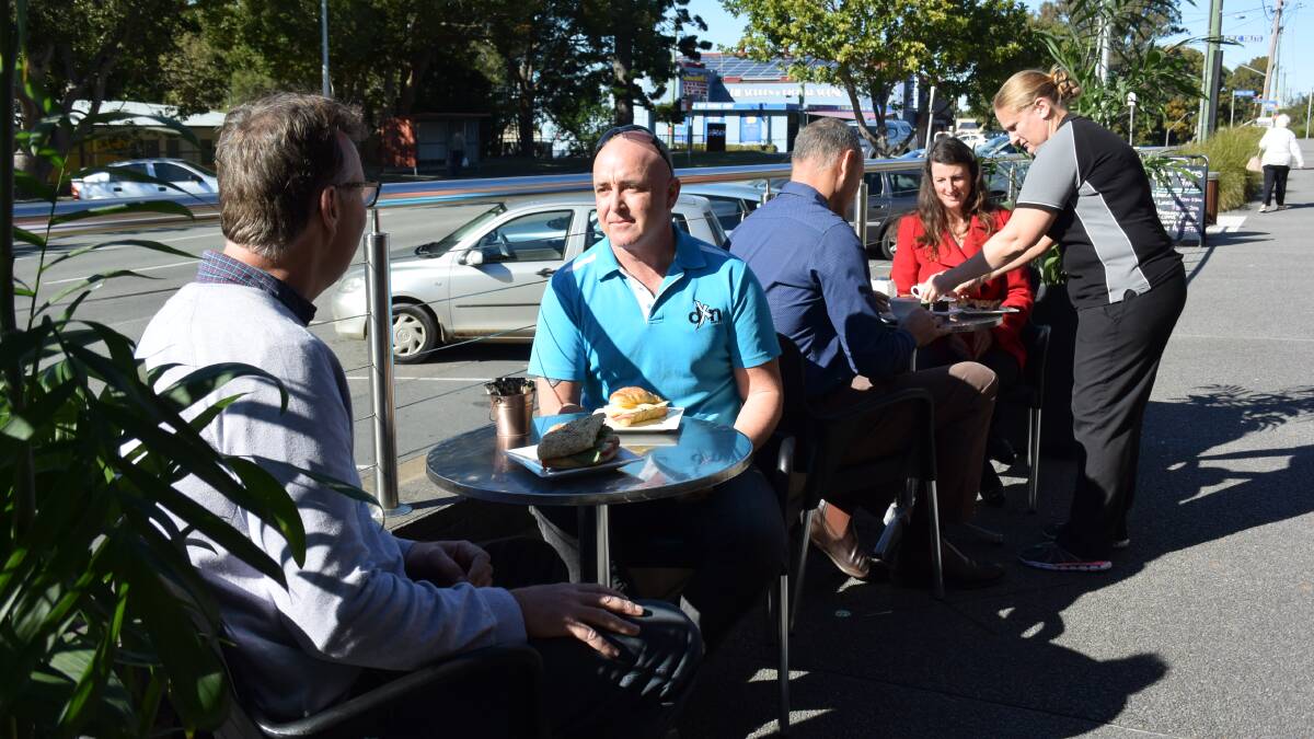 SUN-SHINY DAY: Celebrating the launch of a 12 month outdoor dining trial were, from left, councillor Rob Turner, Camden Haven Chamber president Lee Dixon, mayor Peter Besseling, councillor Sharon Griffiths and Top Spot owner Selena Ewart.