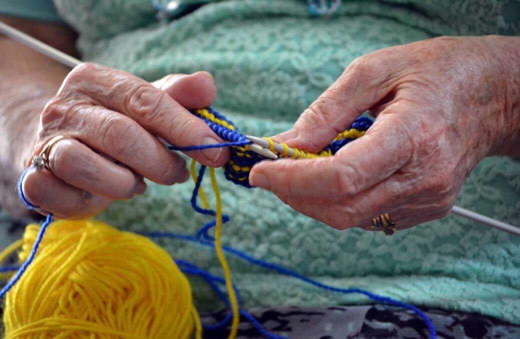 SKILLED HANDS: “I don’t know what I’ll do if I can’t knit, though. It relaxes me. [Knitting rugs] it’s a duty of mine now. Where ever I go the knitting comes with me.”