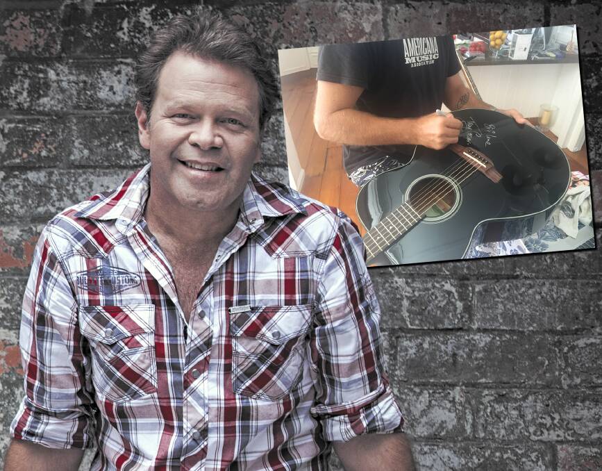 What a prize: Troy Cassar-Daley and, inset, the signed guitar he donated to Rod Nugent's special Olympics fundraising. Photos: Supplied