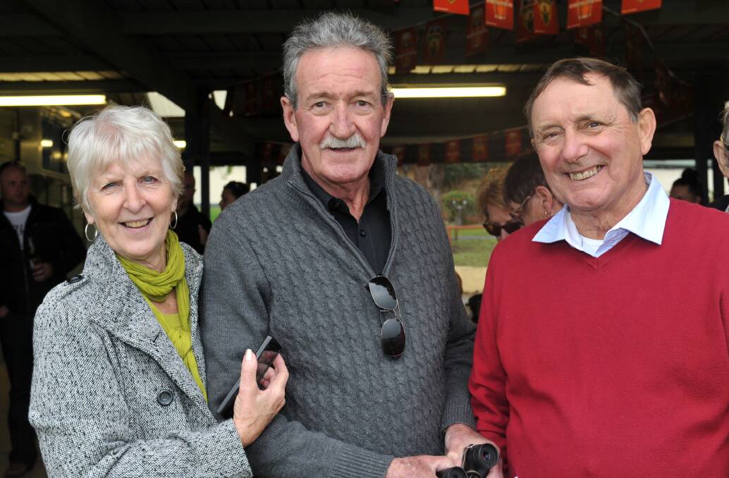 Friends: Patty and Garry Jackson with Peter Coxon waiting for the main race to start.