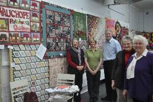Quilts display: Wauchope Patchwork Quilters president, Adrienne van Spanje, The Department Store's Judy Standring, and marketing manager, Tim Walker with members, Lorraine Wedge and Clare Walker with a selection of quilts which officially go on display today.