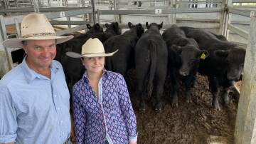 Stephen and Audrey Gill, Alexander Downs, Merriwa with the champion pen of steers, entered by Marina Seven Holdings Pty Ltd, Timor, which averaged 373 kilograms and made 352c/kg, returning $1312. Pictures by Simon Chamberlain