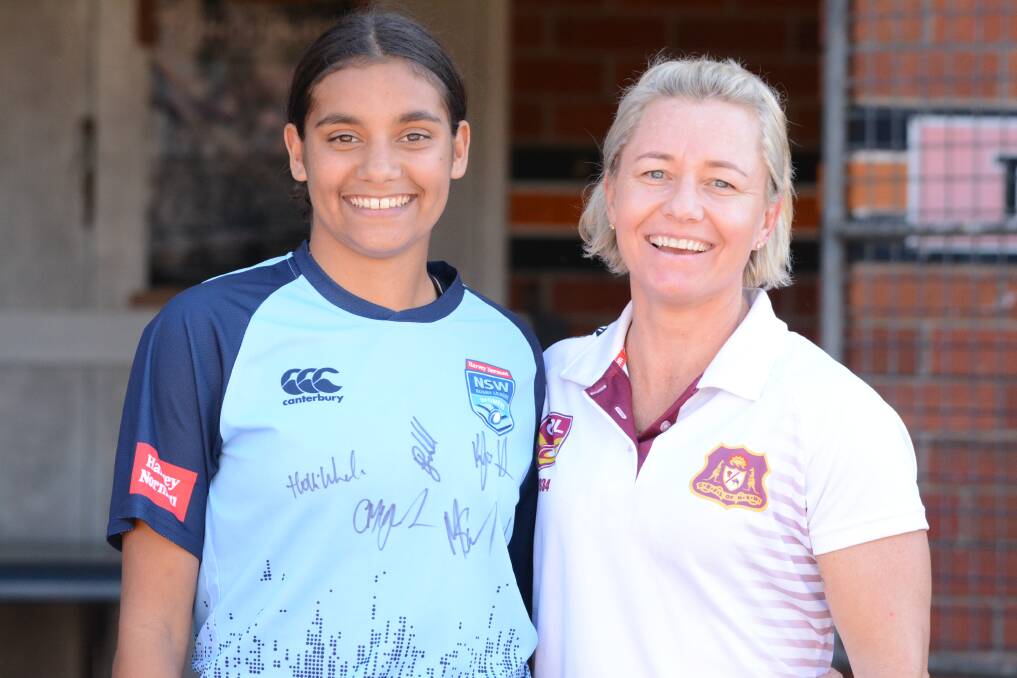 Under 16 girl's nines grand final player of the match, Shontai Fernando with Country Rugby League women's participation officer and NSW State of Origin representative Kylie Hilder. Shontai won a NSW training shirt autographed by the women's State of Origin side. Photo Scott Calvin.