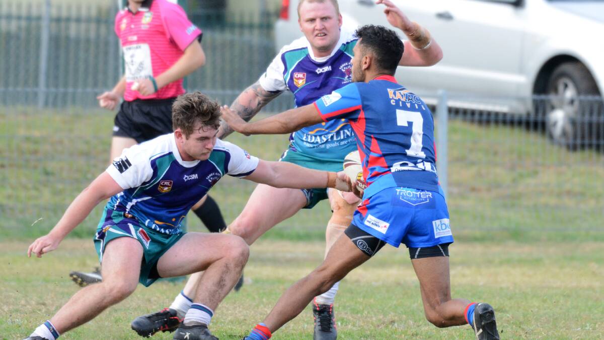Wauchoe halfback Tristan Scott attempts to work his way through Taree defenders during the clash at Taree on June 1. The Blues play Wingham at Wingham on Saturday.