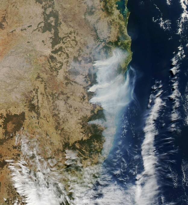 Fires are burning: : A satellite image taken on Thursday, September 12 of bush fires burning across the north coast NSW. Photo: NSW Rural Fire Service Mid Coast District.