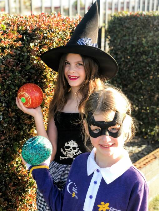 Fun fundraiser: Chloe and Alyssa Robertson are excited for Sunday's Spooky Sunday Barefoot Bowls relay launch.