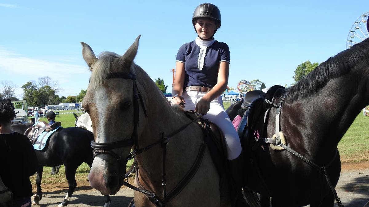 Ready to compete: Amelia Copelin and her horse, Jack, get ready to compete.