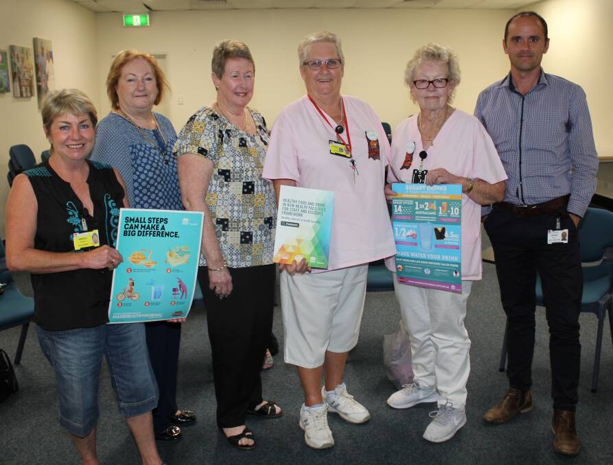 
Sugary drinks: Port Macquarie Pink Lady Mandy Pamplin, Palliative care volunteer coordinator Lyn Nilsson, and Pink Ladies Chris Tait, Gabby Gregory and Dorothy Green with district manager health promotion Andrew Bailey. Photo: supplied