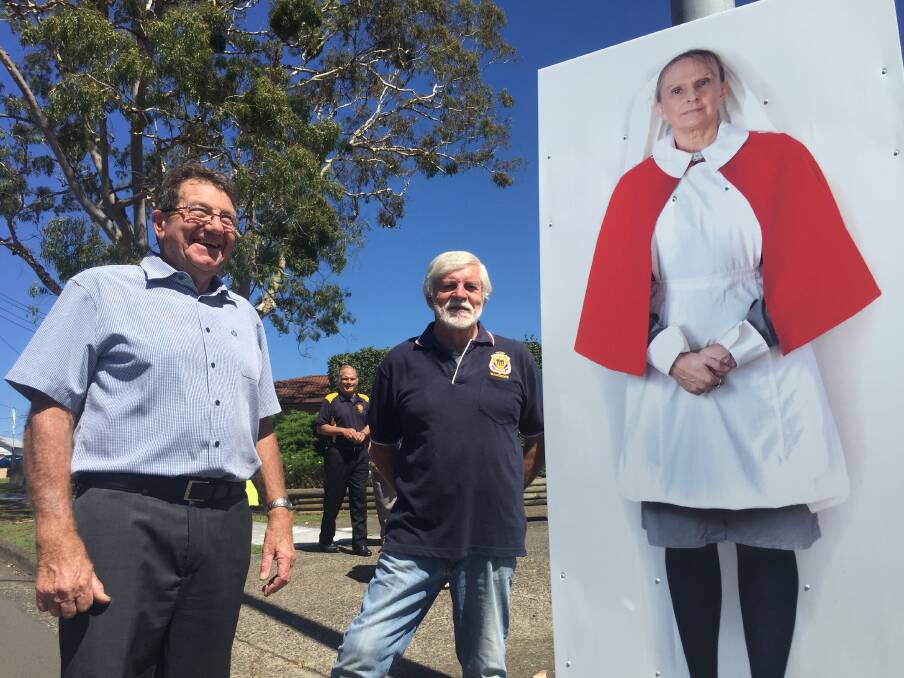Community: Wauchope RSL sub-Branch members, Bill Wagner and Len Barker with one of the life-sized portraits now on show.