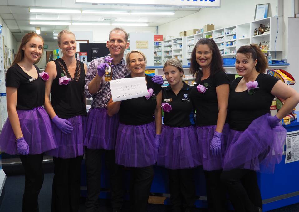 All dressed up: Wauchope Pharmacy staff looking fantastic in all purple as part of the Purple People Market Day.