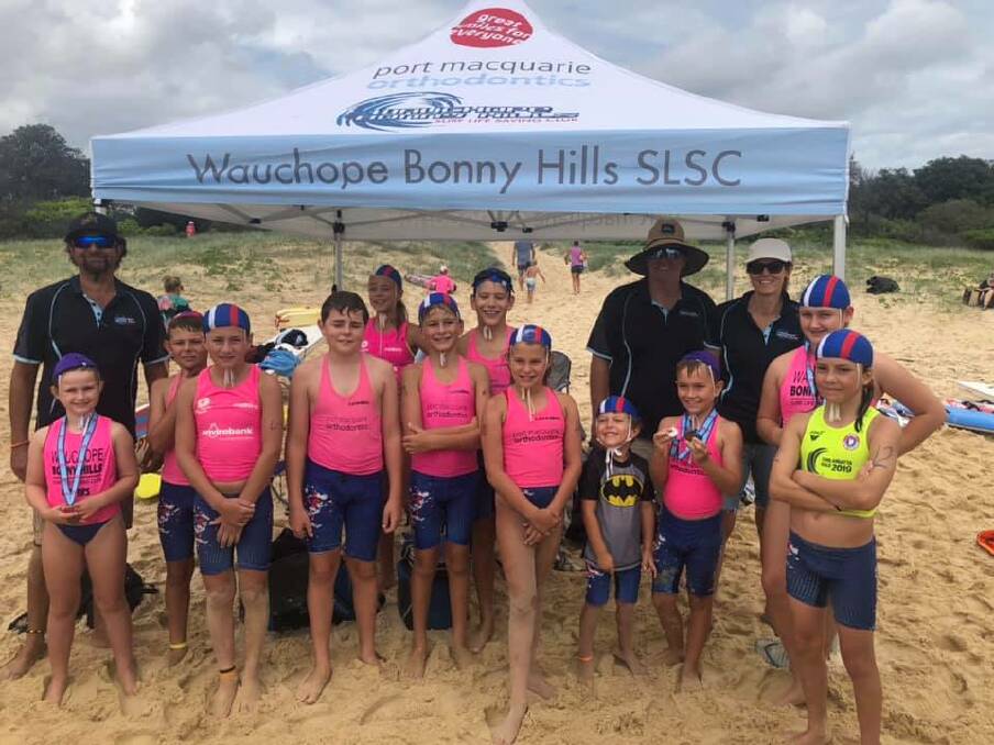 Great day: Some Wauchope-Bonny Hills Surf Life Saving Club members and volunteers at the branch carnival held at South West Rocks on February 22.