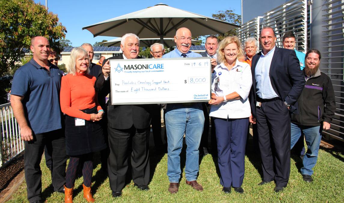 Thank you: Freemasons Alan Williams and Robert Drysdale (centre) were delighted to hand over a massive cheque, $8000, to the Mid North Coast Cancer Institute's Sara Shaughnessy and Jenny Baroutis. With them are masons representing Masonicare and the Lodges of the Hastings Macleay Freemasons Association.