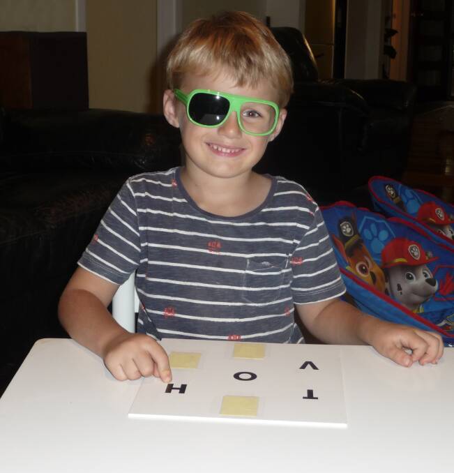 The test: Four-year-old Darcy has his eyesight checked. Photo: supplied