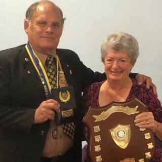 Thank you: Outgoing Rotary president Reg Pierce congratulating Marie Winter on her club member of the year award.