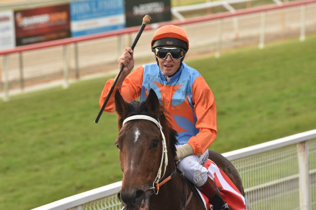 Wauchope boy: Jockey Peter Graham acknowledging the crowd after riding home O'Driscoll.