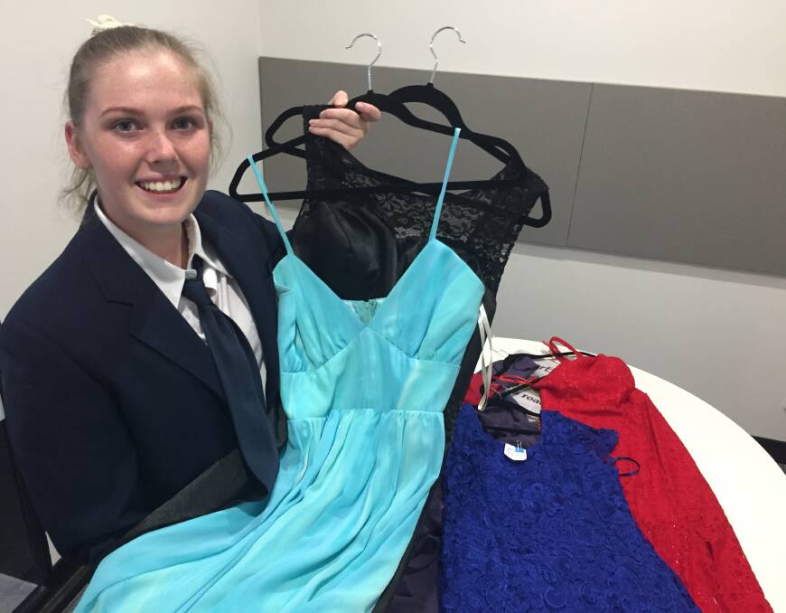 It's a gift: Chelsea Connell with some of the donated formal dresses she plans to 'gift' to students to wear to their respective school formals. Cinderella's Gift, Port Macquarie includes schools from the Camden Haven to Kempsey. Photo: Peter Daniels