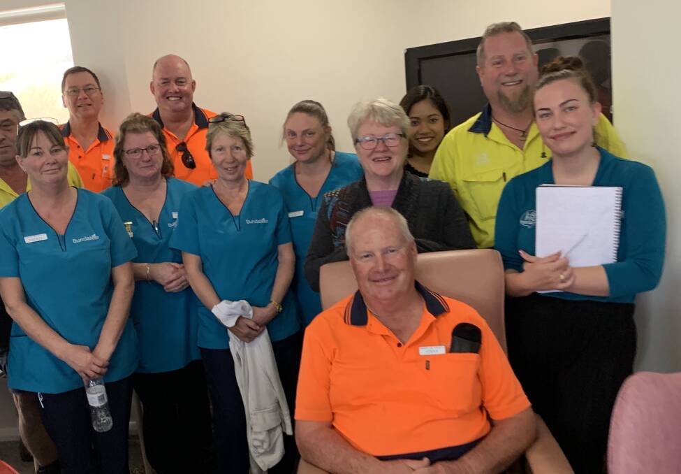Elder abuse: Bundaleer interim CEO Louise Roberts, fourth from right, with fellow Bundaleer staff members discussing elder abuse awareness day, which is on Saturday June 15.