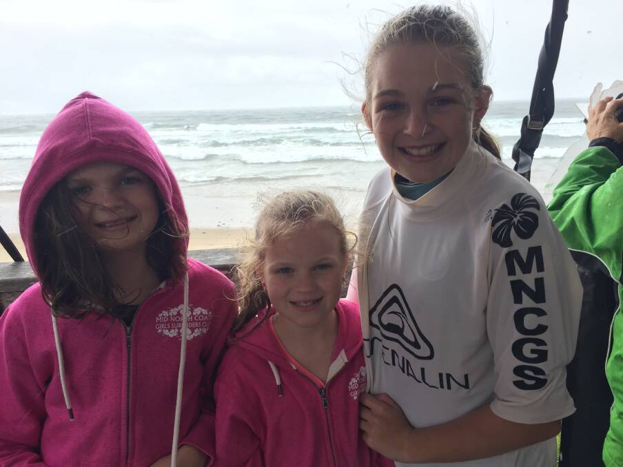 Surfing sisters: Wauchope's Tori, Macy and Ally Knox were having a great time at the girls surf riders' classic at Rainbow Beach, Bonny Hills on the weekend.