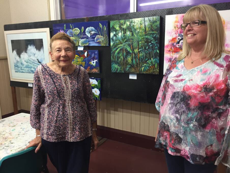 Easter art show: Port Macquarie Art Society's Maureen Cooke and Robyn Richardson preparing for the 44th Easter Art Exhibition in April.