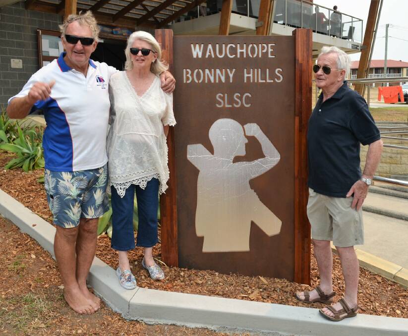 FITTING TRIBUTE: Wauchope Bonny Hills Surf Lifesaving Club life member Wayne Gill with Jo and Brian Stennett and the memorial to their son Simon Stennett who died suddenly three years ago, aged just 34.