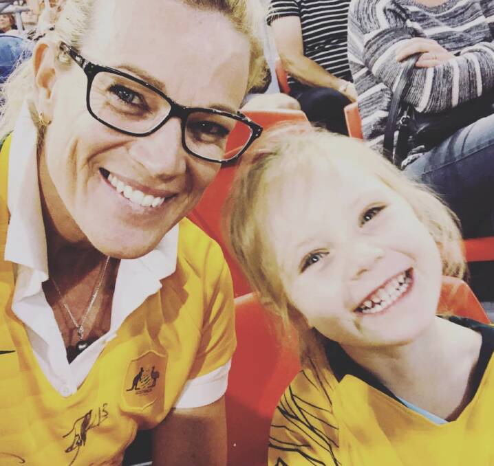 In the blood: Tracie and daughter Zada at Matilda versus Chile match.