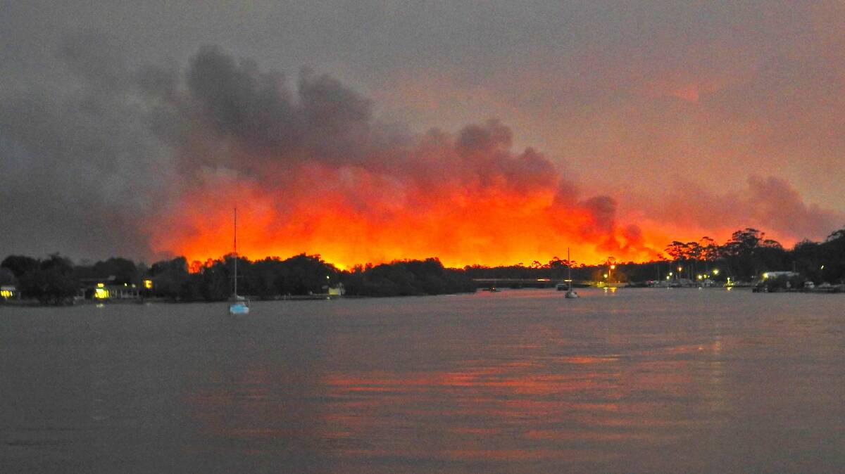 Graphic photo: Marine Rescue Camden Haven unit commander Ken Rutledge provided us with this powerful photo of the Crowdy fire that threatened Dunbogan.