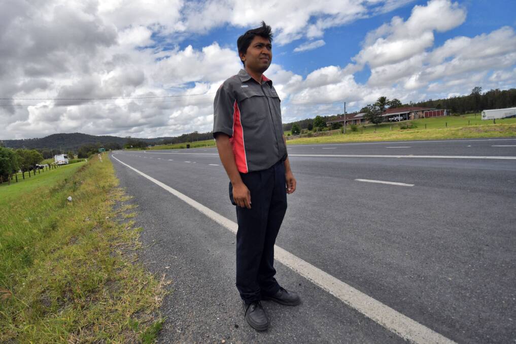 We need help: The co-owner of Liberty Service Station Dinesh Thakrani standing on the  old Pacific Highway fronting his service station. Dinesh is calling for signage on the new highway pointing to business and facilities available in Telegraph Point. Photo: Oscar Carter