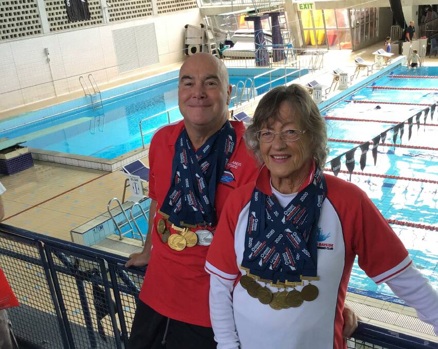 MEDAL WINNERS: Redlands Bayside Masters Swimming Club coach Trevor Green with swimmer Dot Simmons at the New Zealand Masters Games in February. 