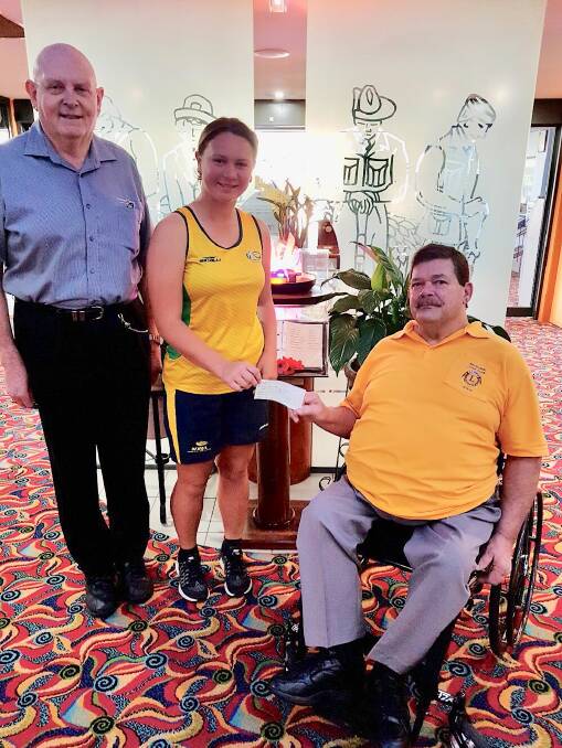 HELPING A STAR: Graham Withers from Wauchope RSL with Emily Wright and Stephen Perkins from the Wauchope Lions Sports Foundation.