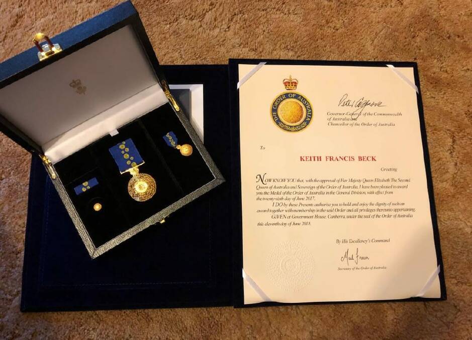 The stolen OAM medal and citation for Dr Keith Beck.