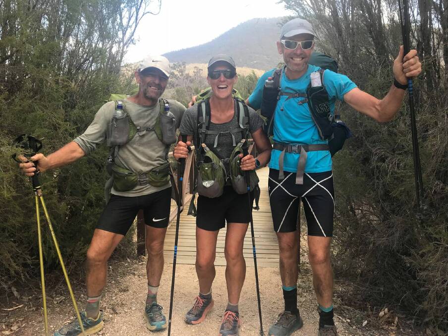 VICTORY: Phil Robinson, Kylie Salm and John Riley complete the fastest known time for the 659 km Australian Alps Walking Track. Photo supplied.