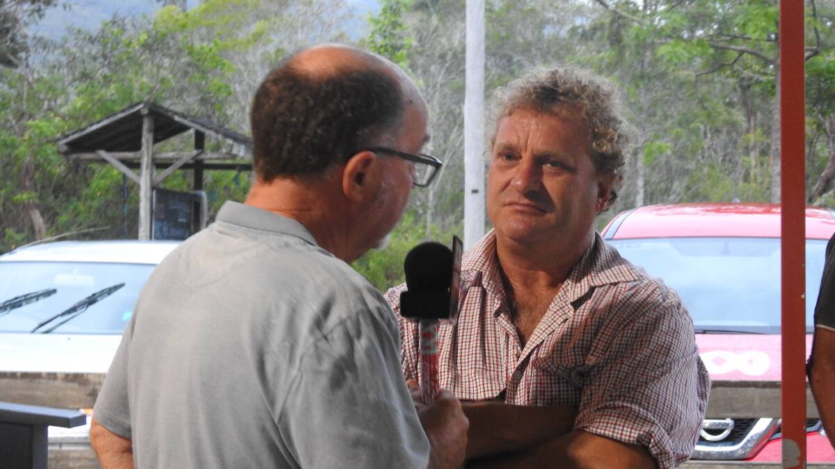 Michael Cavanagh from the ABC interviews Pappinbarra farmer Mark Hickson at Hollisdale Hall.