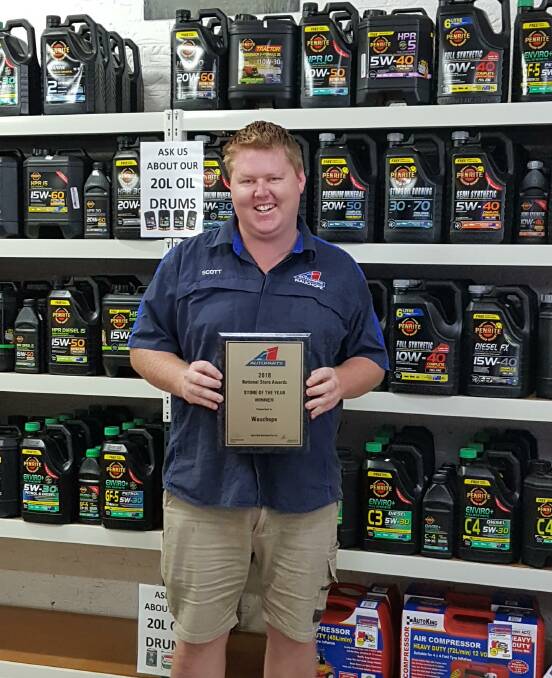 A1 Auto Parts Wauchope store manager Scott Rayner holding the award.