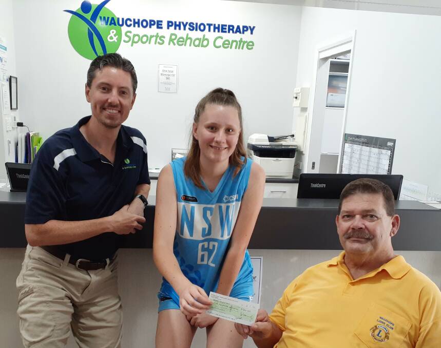 BOOST: Nathan Lynch from Wauchope Physiotherapy, Hayley Eggleton and Stephen Perkins from the Wauchope Lions Sports Foundation.