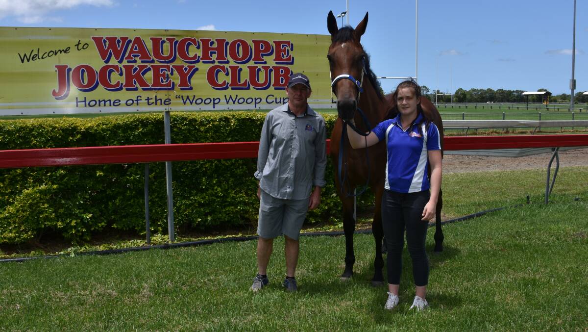 RARING TO GO: Wauchope Jockey Club president Greg Partridge and his daughter, apprentice jockey Mollie Partridge with Raining on Sunday who will run in the Woop Woop Cup on Boxing Day.