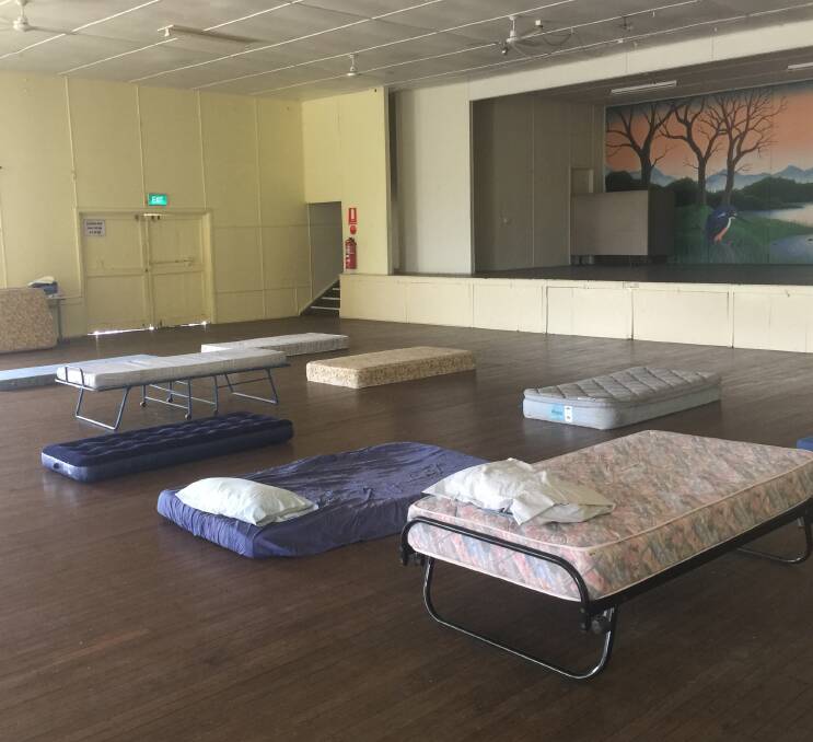 Makeshift beds set up in Wauchope Showground hall during last year's bush fires.