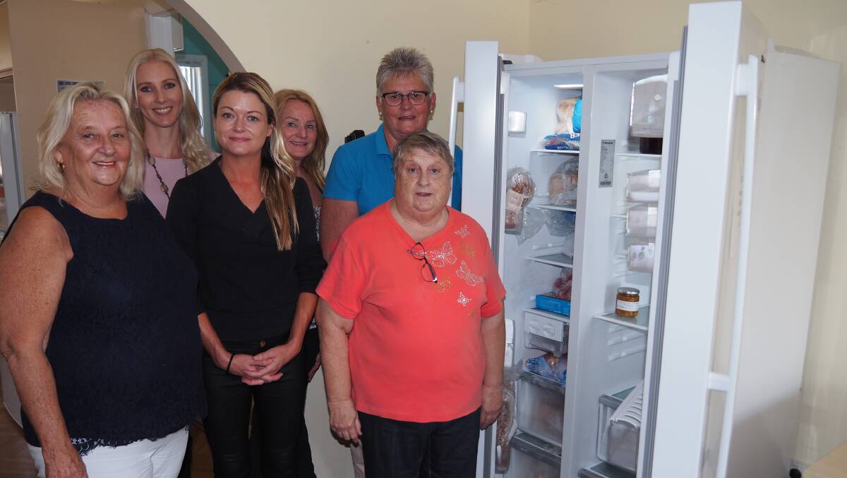 Staff and volunteers from the Wauchope Neighbourhood Centre received ETC funding for a new fridge, washing machine and water tanks.