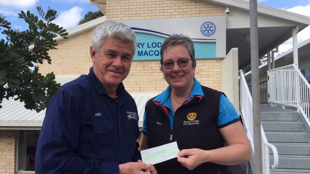Yesteryear Truck Show's Greg Cavanagh presents a cheque to Paula Johnson at Rotary Lodge at Port Macquarie Base Hospital.