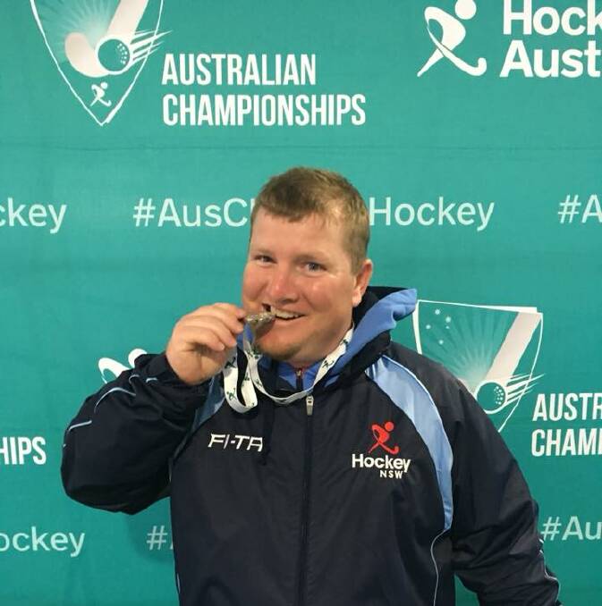 DELIGHTED: Colin Pursehouse from Wauchope Hockey Club with his silver medal at the Australian country  championships.