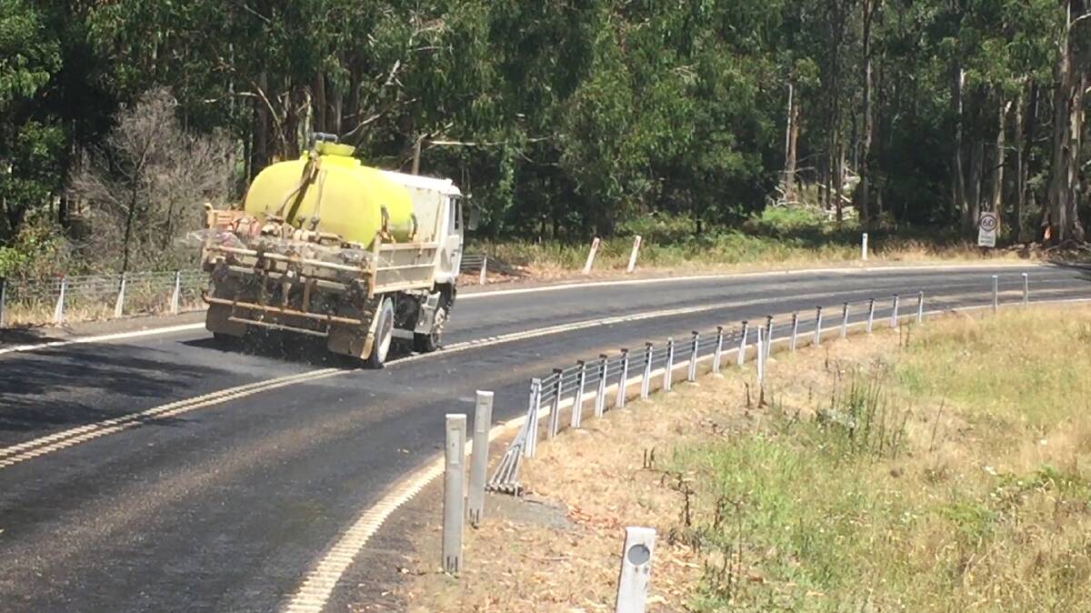 Spraying water on the Oxley Highway between Toms Creek and Walcha.
