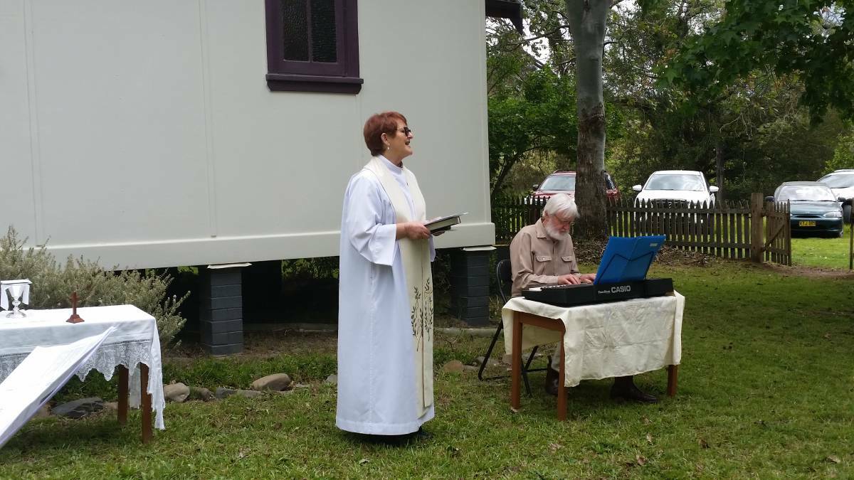 HAPPIER TIMES: Reverend Judy Taylor leads a Blessing of the Animals Service at All Saints Church in Pappinbarra in November 2016.