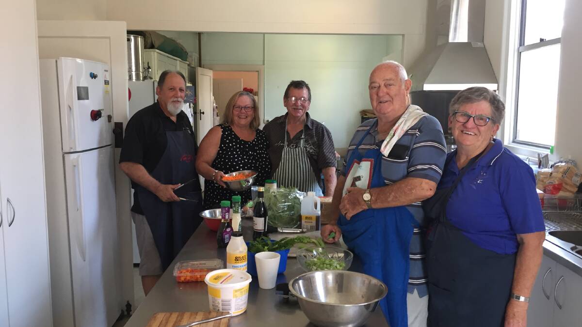 CARING VOLUNTEERS: George Watkins, Rose Benjamin, Peter Campbell, Garry Wright and Carol Higgins give their time and energy every week to provide free meals.