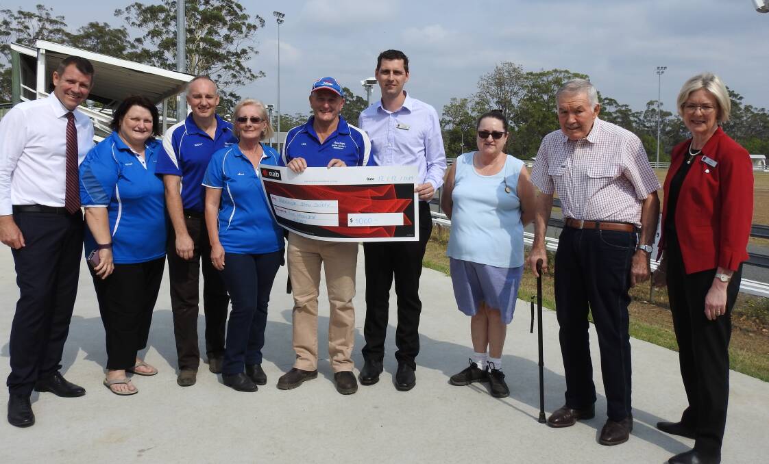 HAPPY DAY: Mike Baird from NAB, Heather Lattimore, Scott Balmer, Anne Watkins, Neil Coombes from Wauchope Show Society, NAB's Coren Beeton, Trish Douglas and Darryl Hosking from the Show Society and Kim Dahler from Wauchope NAB.