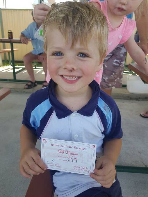 Hudson Cook with his voucher.