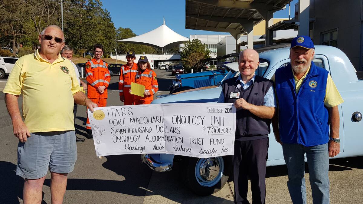 BIG CHEQUE: Ron 'Rocket Turnbull and HARS president Chris Whalley with Cancer Care Coordinator Ken Proctor and (back) Race Club CEO Michael Bowman ad SES volunteers Jared Bradley and Phil and Rose Johnson.