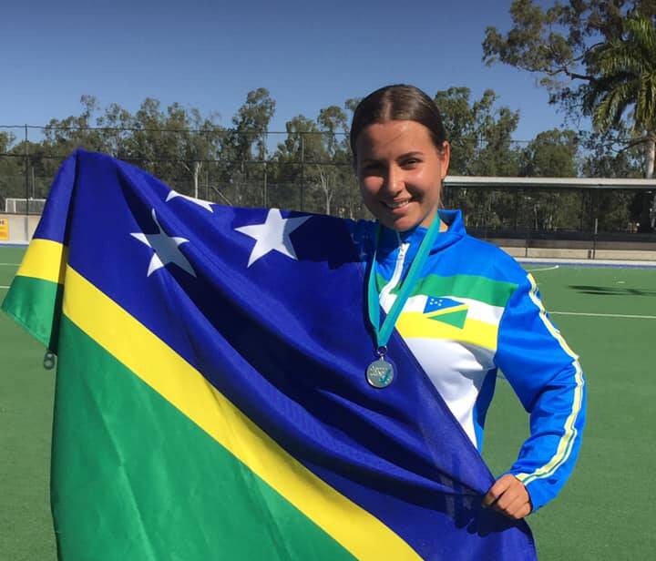 CELEBRATING SUCCESS: Indy Howell, who is a member of Wauchope Hockey Club, celebrates helping Solomon Islands win silver at the Oceania Cup. Photo supplied.