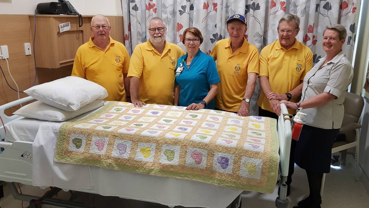 HELPFUL: Wauchope Lions Jim Munro, Gordon Douglass, Bruce Cant and Mike Hussey with Wauchope Nurse Manager Judy Beilby and Palliative Care Nurse Unit Manager Mary Trotter in one of the patient rooms that now has a new, comfortable pressure mattress.