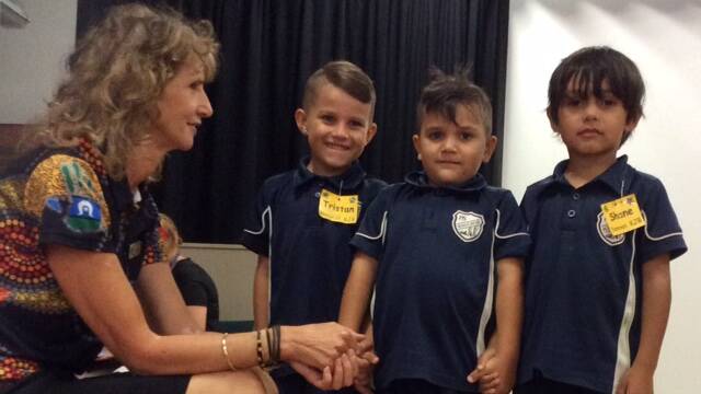 PROUD MOMENT: Mrs Julie Best with Tristan, Teo and Shane as they give Acknowledgement of Country at Wauchope Public School's first kindergarten assembly of the year.